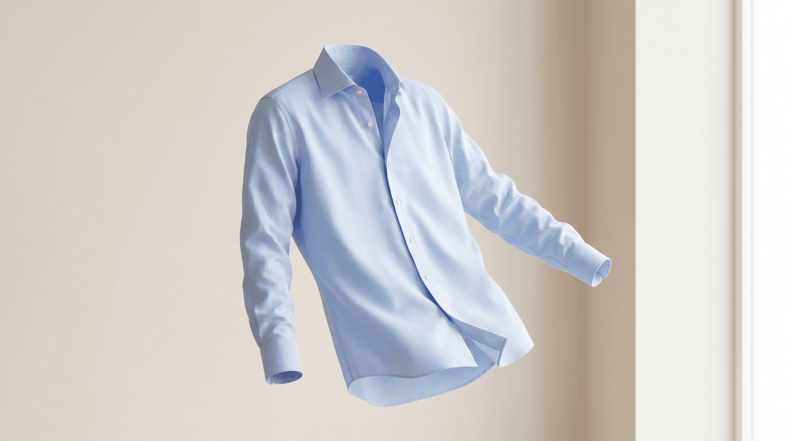 Floating light-blue shirt on a cream background